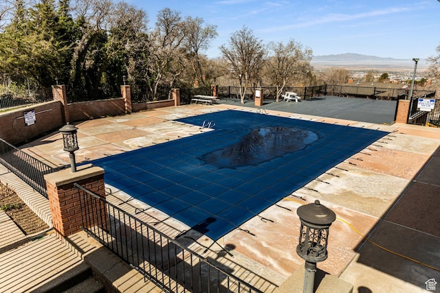 1357 E Ridgewood Ln S, Bountiful, UT 84010 - community pool featuring a patio area, fence, and a mountain view