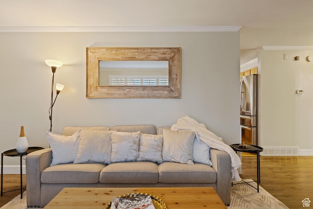 3168 W Ryan Dr, Taylorsville, UT 84129 - living area featuring visible vents, baseboards, crown molding, and wood finished floors