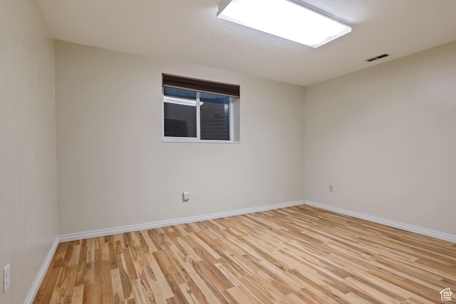 3168 W Ryan Dr, Taylorsville, UT 84129 - unfurnished room featuring visible vents, baseboards, and light wood-type flooring