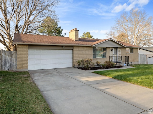 3168 W Ryan Dr, Taylorsville, UT 84129 - ranch-style house featuring an attached garage, a chimney, fence, a front lawn, and driveway