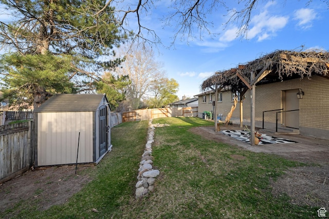 3168 W Ryan Dr, Taylorsville, UT 84129 - view of yard with a storage shed, a fenced backyard, and an outbuilding