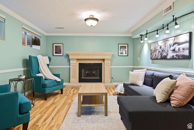 3168 W Ryan Dr, Taylorsville, UT 84129 - living area featuring crown molding, visible vents, and wood finished floors