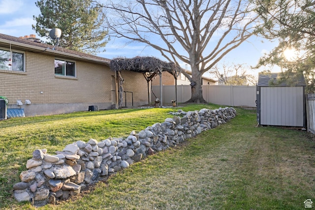 3168 W Ryan Dr, Taylorsville, UT 84129 - view of yard with cooling unit, a fenced backyard, a storage shed, and an outbuilding
