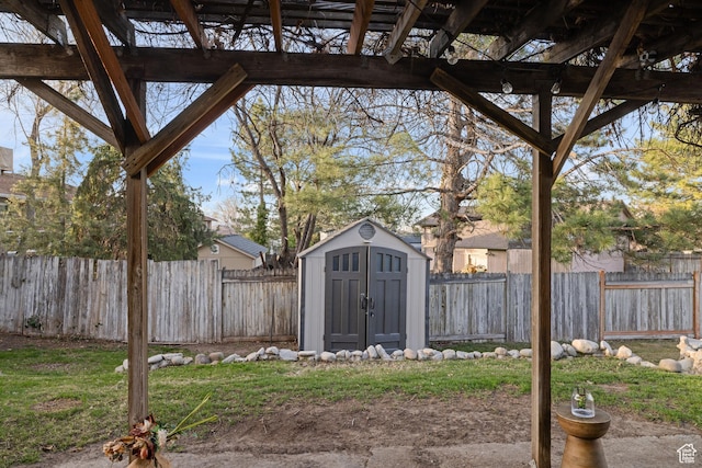 3168 W Ryan Dr, Taylorsville, UT 84129 - view of yard featuring a fenced backyard, an outdoor structure, and a shed