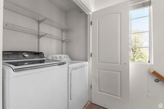 washroom featuring laundry area and washing machine and clothes dryer