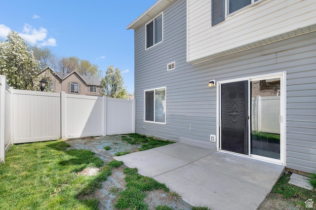 exterior space with a patio and a fenced backyard