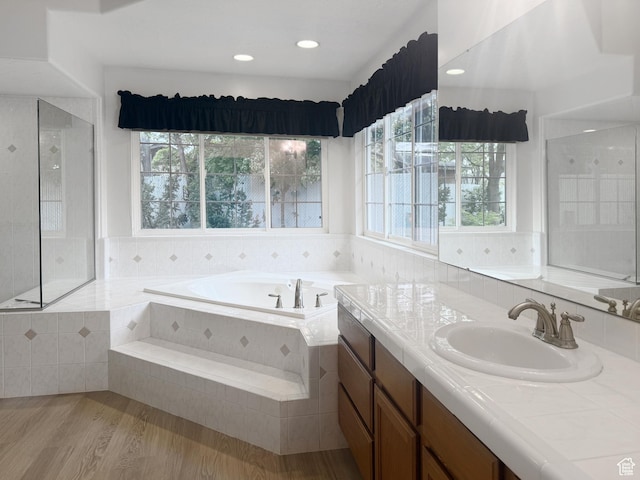 1181 W 4550 S Unit 26, Riverdale, UT 84405 - bathroom with plenty of natural light, a garden tub, wood finished floors, and vanity