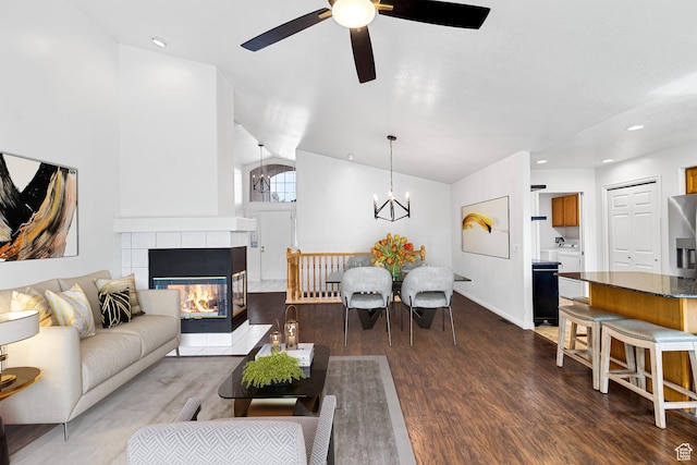 1181 W 4550 S Unit 26, Riverdale, UT 84405 - living area featuring ceiling fan, lofted ceiling, dark wood-style flooring, a chandelier, and a fireplace