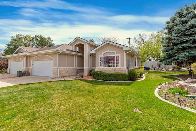 1181 W 4550 S Unit 26, Riverdale, UT 84405 - ranch-style home with an attached garage, driveway, stucco siding, and a front lawn