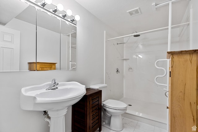 1181 W 4550 S Unit 26, Riverdale, UT 84405 - bathroom with marble finish floors, a marble finish shower, and toilet