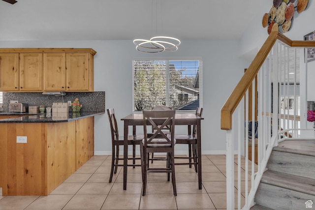 358 W Bricker Rd, Draper, UT 84020 - dining area with stairs, a notable chandelier, baseboards, and light tile patterned flooring