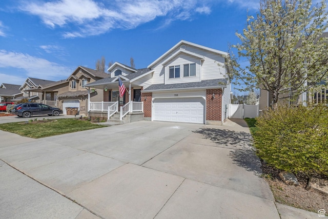 358 W Bricker Rd, Draper, UT 84020 - view of front of house with concrete driveway, brick siding, fence, and an attached garage