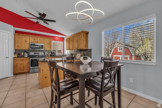 358 W Bricker Rd, Draper, UT 84020 - kitchen featuring appliances with stainless steel finishes, light tile patterned floors, dark countertops, and backsplash