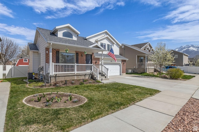 358 W Bricker Rd, Draper, UT 84020 - view of front of property with covered porch, brick siding, a front yard, a gate, and driveway