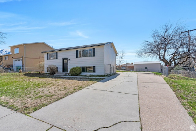 794 N Amethyst St, Layton, UT 84041 - bi-level home featuring driveway, fence, and a front lawn