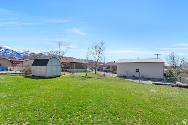 794 N Amethyst St, Layton, UT 84041 - view of yard with fence, an outbuilding, and a storage unit