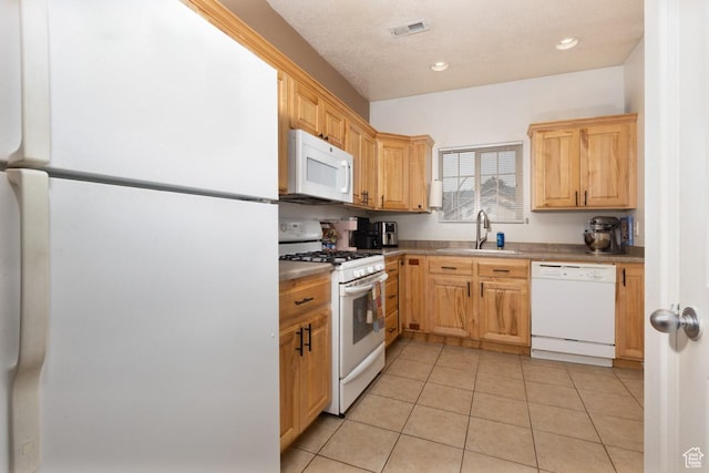 280 N Beacon Dr W, Cedar City, UT 84720 - kitchen with recessed lighting, white appliances, light tile patterned floors, visible vents, and a sink