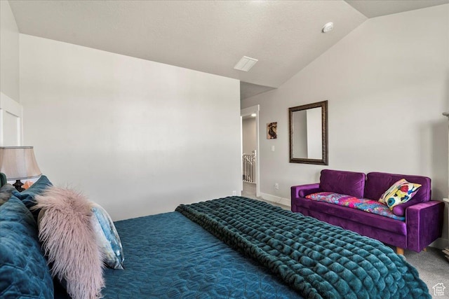 bedroom featuring baseboards, lofted ceiling, and carpet floors