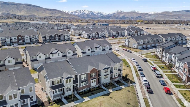 drone / aerial view featuring a residential view and a mountain view