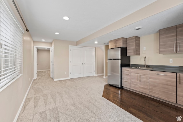 763 S Silver Leaf Dr, Mapleton, UT 84664 - kitchen with baseboards, a sink, freestanding refrigerator, dark countertops, and recessed lighting