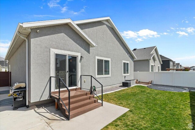 249 N 590 E, Vineyard, UT 84059 - back of house with a patio area, fence, a lawn, and stucco siding
