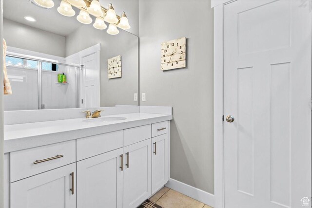 249 N 590 E, Vineyard, UT 84059 - bathroom with tile patterned flooring, vanity, baseboards, and a stall shower