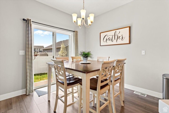 249 N 590 E, Vineyard, UT 84059 - dining room featuring baseboards, wood finished floors, a notable chandelier, and visible vents