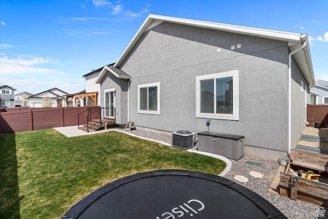 249 N 590 E, Vineyard, UT 84059 - back of house featuring central AC, fence, a lawn, and stucco siding