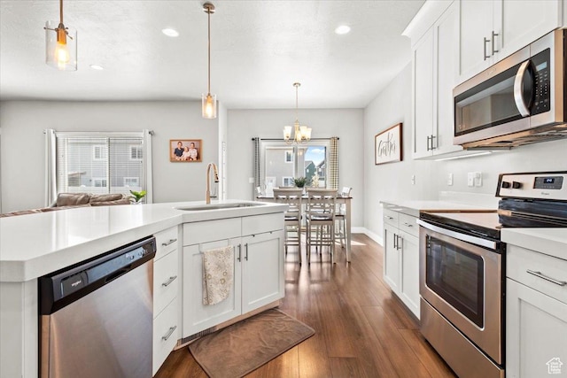 249 N 590 E, Vineyard, UT 84059 - kitchen with an inviting chandelier, light countertops, dark wood-type flooring, appliances with stainless steel finishes, and a sink