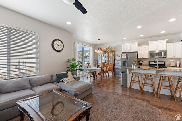 2046 W Fairway Ln, Orem, UT 84058 - living room with ceiling fan, dark wood finished floors, and recessed lighting