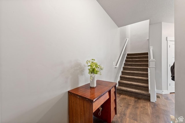 2046 W Fairway Ln, Orem, UT 84058 - staircase with a textured ceiling and wood finished floors
