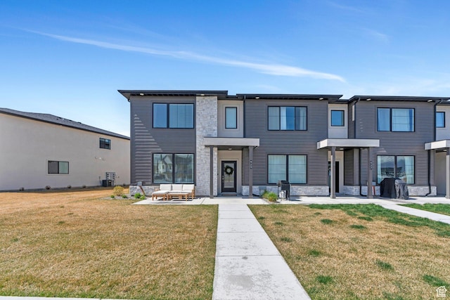 929 S 950 W, American Fork, UT 84003 - view of front of home featuring a front lawn, stone siding, and central air condition unit