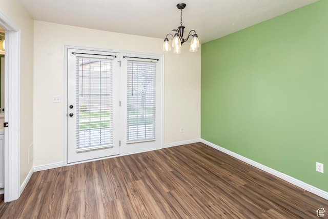 187 E 2300 N, North Ogden, UT 84414 - unfurnished room with baseboards, a chandelier, and wood finished floors