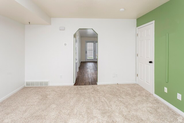 187 E 2300 N, North Ogden, UT 84414 - unfurnished room with visible vents, baseboards, arched walkways, and carpet floors