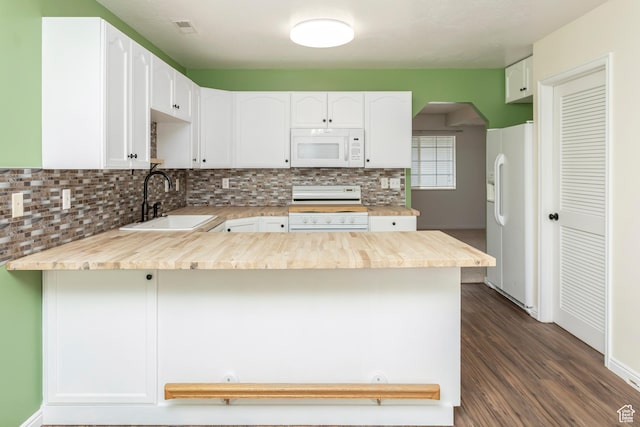 187 E 2300 N, North Ogden, UT 84414 - kitchen with tasteful backsplash, white appliances, a peninsula, light countertops, and a sink