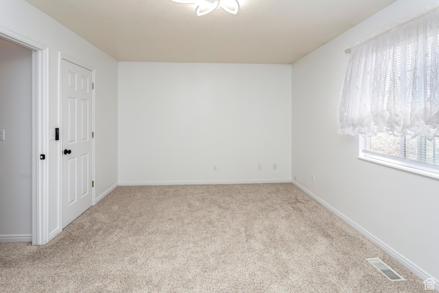 187 E 2300 N, North Ogden, UT 84414 - carpeted spare room featuring visible vents and baseboards