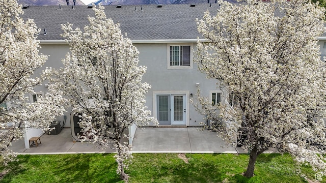 187 E 2300 N, North Ogden, UT 84414 - rear view of house featuring a patio, roof with shingles, stucco siding, and french doors