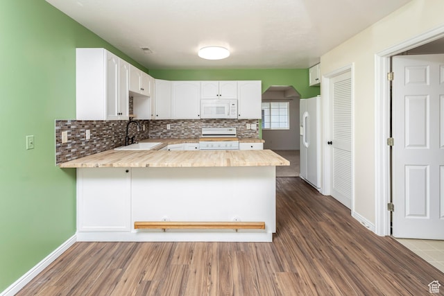 187 E 2300 N, North Ogden, UT 84414 - kitchen featuring white appliances, light countertops, a sink, and a peninsula