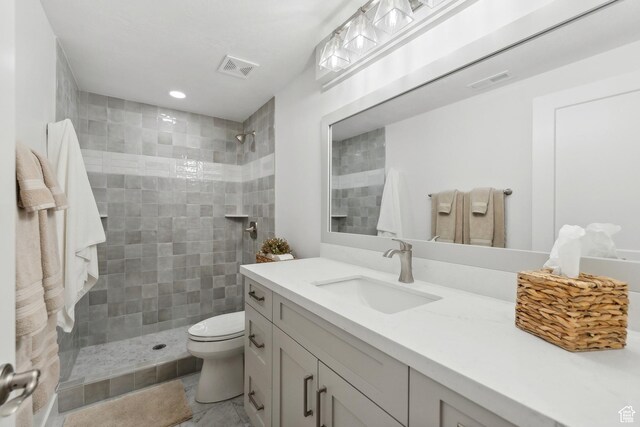 1375 S Red Filly Rd, Heber City, UT 84032 - bathroom featuring vanity, visible vents, a tile shower, and toilet