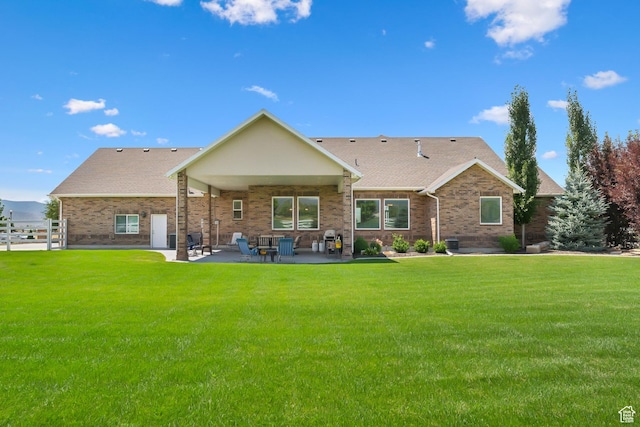 1375 S Red Filly Rd, Heber City, UT 84032 - rear view of house featuring a patio area, brick siding, and a yard