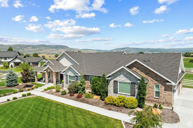 1375 S Red Filly Rd, Heber City, UT 84032 - view of front of property with a front yard, a mountain view, brick siding, and stone siding