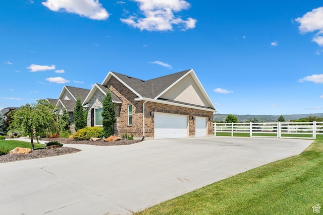 1375 S Red Filly Rd, Heber City, UT 84032 - view of home's exterior with concrete driveway, brick siding, and fence
