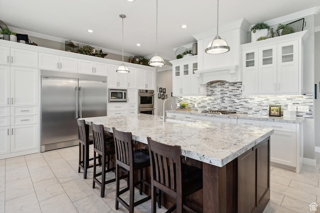 1375 S Red Filly Rd, Heber City, UT 84032 - kitchen featuring built in appliances, a breakfast bar, glass insert cabinets, marble finish floor, and a sink