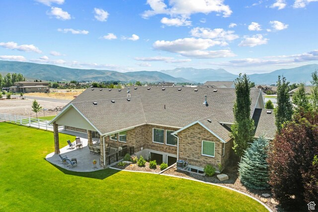 1375 S Red Filly Rd, Heber City, UT 84032 - back of house featuring a yard, a mountain view, fence, and a patio