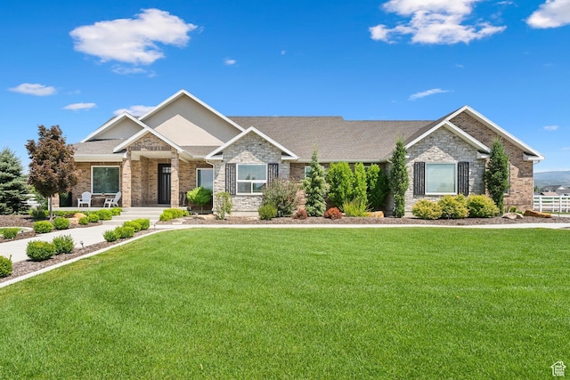 1375 S Red Filly Rd, Heber City, UT 84032 - craftsman-style house with a front yard and stone siding