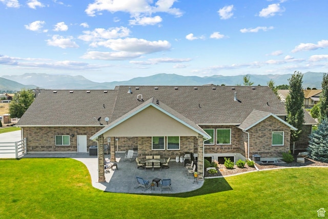 1375 S Red Filly Rd, Heber City, UT 84032 - back of property with a mountain view, a patio area, fence, and a lawn