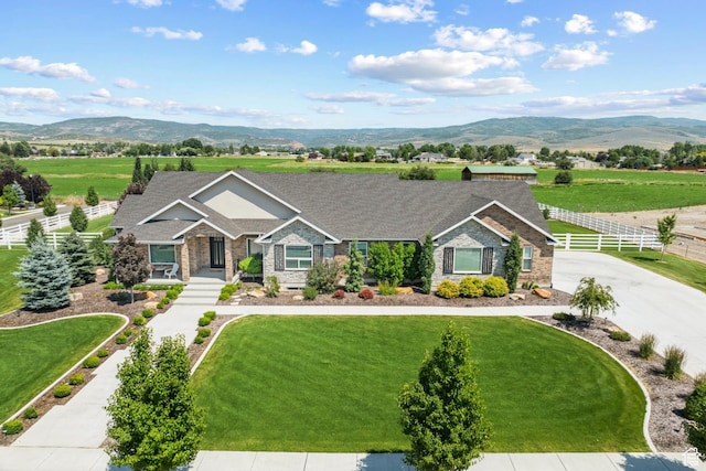 1375 S Red Filly Rd, Heber City, UT 84032 - view of front facade featuring a front yard, a mountain view, fence, and a shingled roof