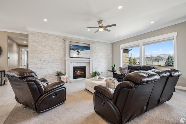 1375 S Red Filly Rd, Heber City, UT 84032 - living area with ornamental molding, a ceiling fan, a glass covered fireplace, and recessed lighting
