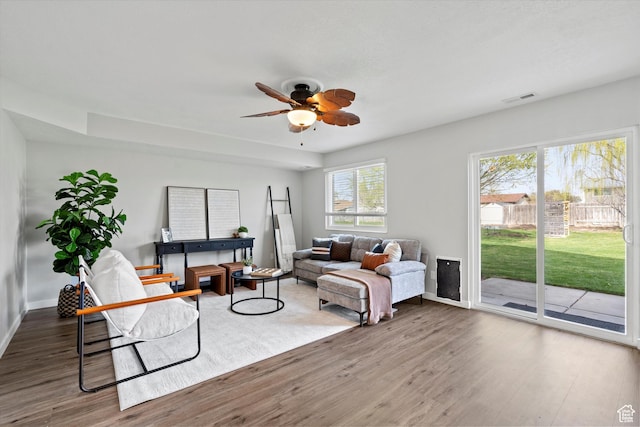 2124 N 2525 W, Clinton, UT 84015 - living area featuring visible vents, ceiling fan, baseboards, and wood finished floors