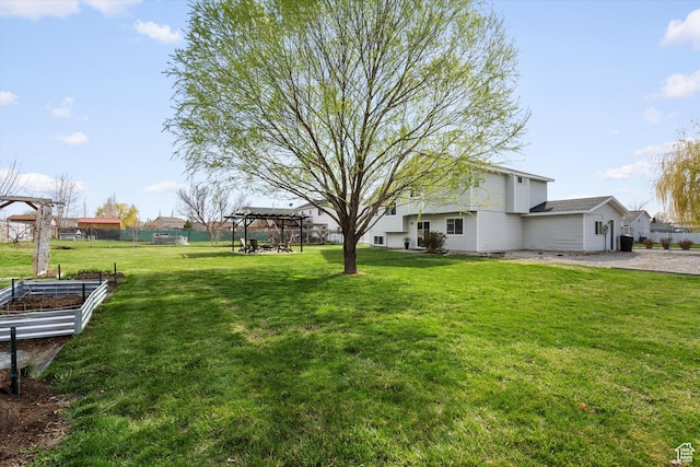 2124 N 2525 W, Clinton, UT 84015 - view of yard featuring fence and a vegetable garden